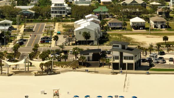 Lifeguard Station And Public Bathrooms Gulf Shores Beach Alabama. 4k Telephoto Drone Aerial