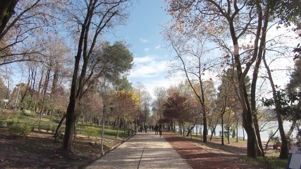 Walkway leisure path crossing Tirana's Grand park alongside the artificial Lake in Albania