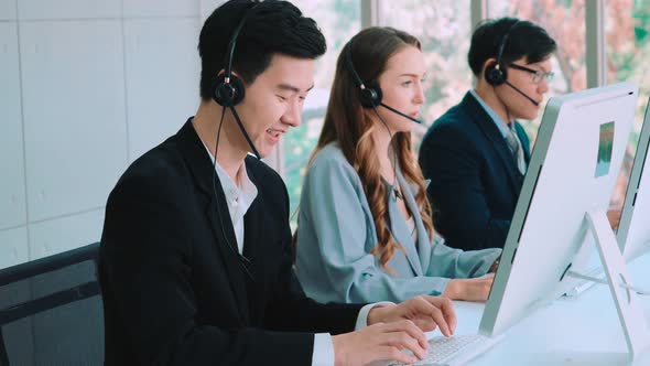 Business People Wearing Headset Working in Office