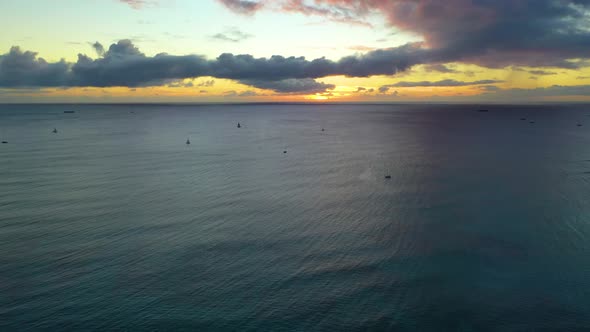 Aerial View of a Fleet of Sailboats Scattered Across The Ocean Off the Coast of Waikiki Beach In Hon