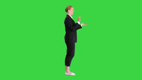Pretty Blonde Woman Smiling and Clapping Hands on a Green Screen Chroma Key