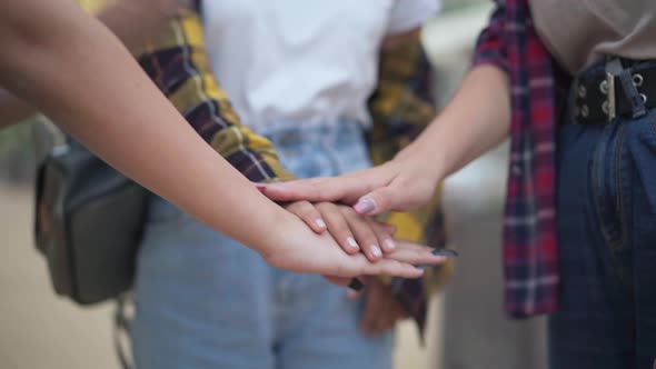 Closeup Handstack of Teenage Caucasian Female Hands Outdoors