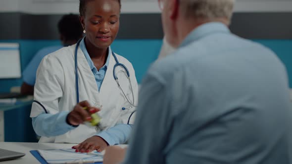 Close Up of Medical Specialist Using Stamp on Papers