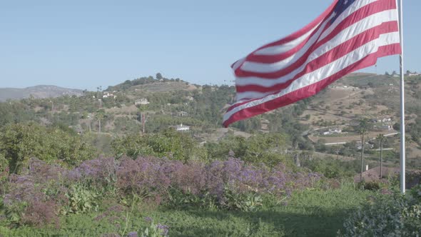 American Flag flying high over Fallbrook, California Mountains