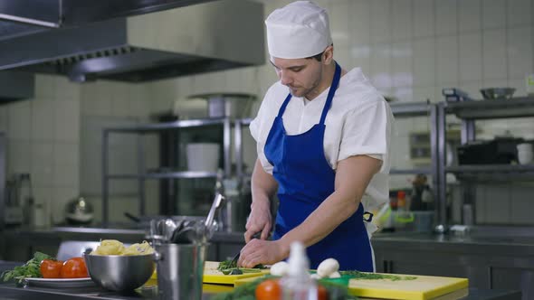 Exhausted Handsome Young Male Cook Cutting Salad Ingredients Wiping Forehead Sighing