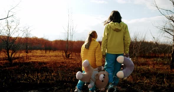 Kids Holding Fluffy Bears in Clothes in the Colors of the Ukrainian Flag