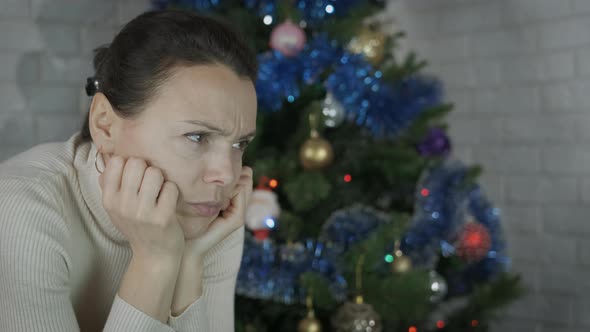 Female Feeling Depressed at Christmas Celebration