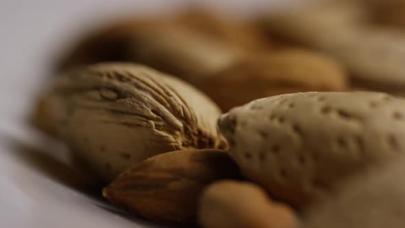 Cinematic, rotating shot of almonds on a white surface - ALMONDS 190