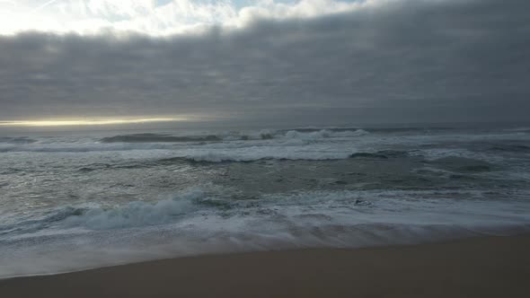 Aeral view of beach and sea with rain clouds