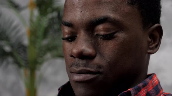 Close Up Face African American Businessman Works Laptop Chatting with Employees