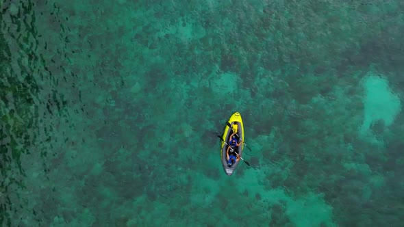 Aerial View of Yellow Kayak in Blue Lagoon at Summer