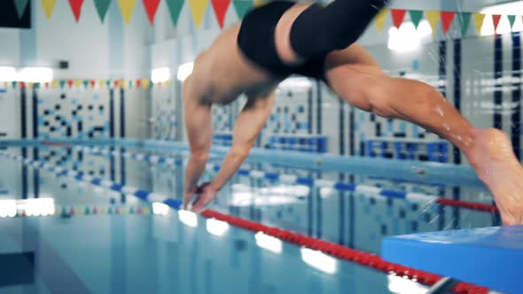 A Man with Bionic Leg Jumps Into a Pool, Swimming Workout