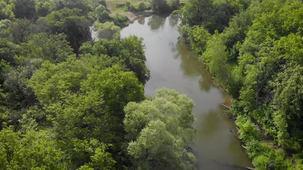 An Aerial View. Beautiful Summer Landscape in the Middle Strip of Russia. Along the Narrow, Winding