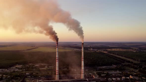 Industrial pipes with smoke in the evening. 