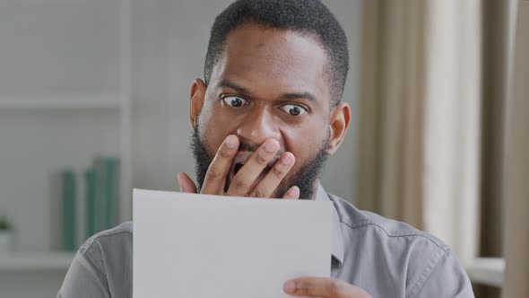 Excited Black Male Executive Receiving Mail with Salary Growth Payment Business Loan Approval