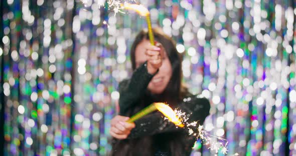 Cheerful Woman Waving Sparklers at the Party Teenage Girl Enjoying New Years Eve with Fireworks