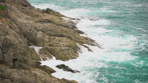 Rock and Waves in The Turquoise Sea. the Power and Beauty of The Ocean