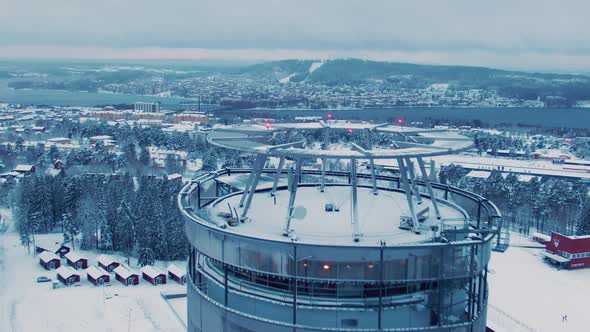 Aerial flyover Arctura restaura revealing Östersund skyline on a winter day