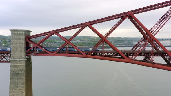 A Commuter Train Crossing a Bridge in Scotland