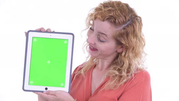 Face of Happy Beautiful Blonde Businesswoman Showing Digital Tablet