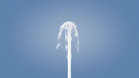 Fountain milk splash isolated on blue background.