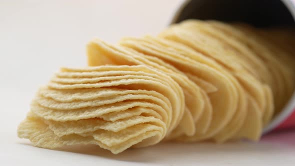 Close Up of Chips Spilling on White Background