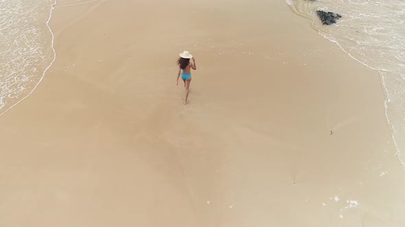 Flyover Hispanic Girl In Bikini Walking On Beach 2