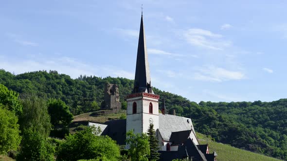 Static time lapse of a country church in a small German village during spring.