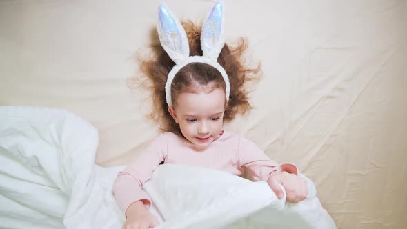 A Cute Little Girl with Bunny Ears
