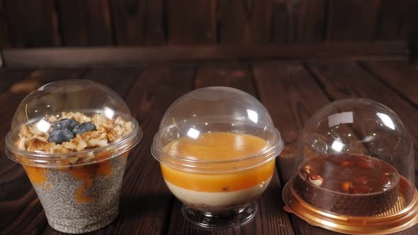 Closeup of Various Fruit Desserts with Chia Seeds Nuts and Berries on a Table