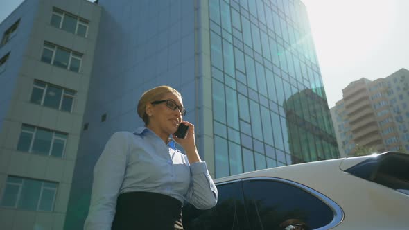 Extremely Happy Lady Rejoicing Promotion or Successful Contract by Smartphone