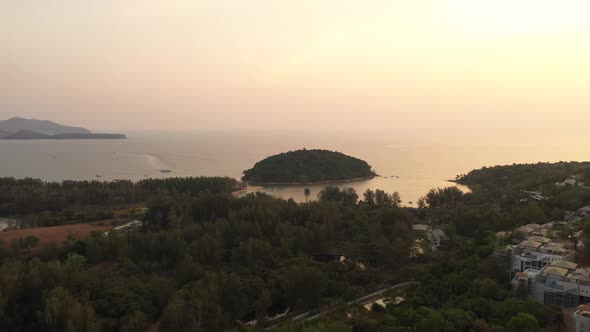 Drone Flight Over the Jungle and Sea City After Sunset
