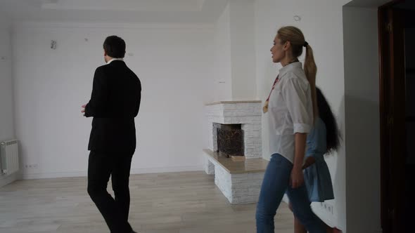 Realtor Showing New House To Mixed Race Couple
