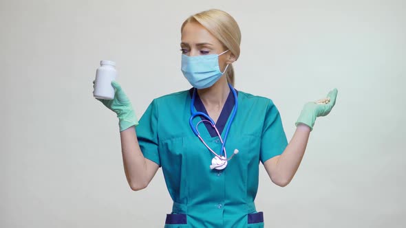 Medical Doctor Nurse Woman Wearing Protective Mask - Holding Can of Pills or Vitamins