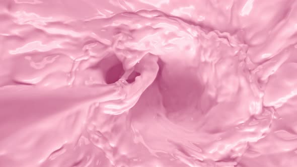 Super Slow Motion Shot of Pouring Pink Milk Into Wortex at 1000Fps.