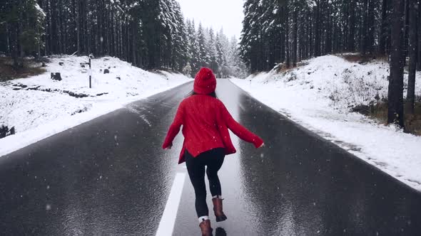 A Beautiful Smiling Girl Running Across the Road