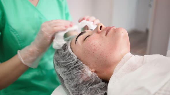 Woman Beautician Makes Procedures Facial Cleans Patient