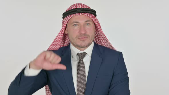 Arab Businessman showing Thumbs Down Gesture, White Background