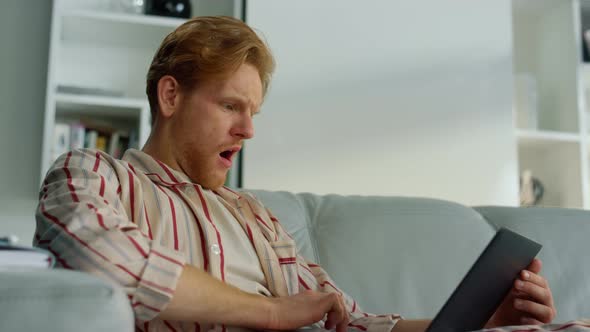 Man Working Laptop Yawning at Home Office Closeup