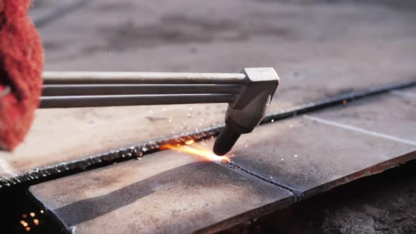 gas cutting of metal, sparks fly