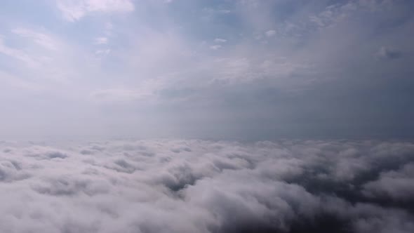 Aerial Perspective View of Flying Over Clouds