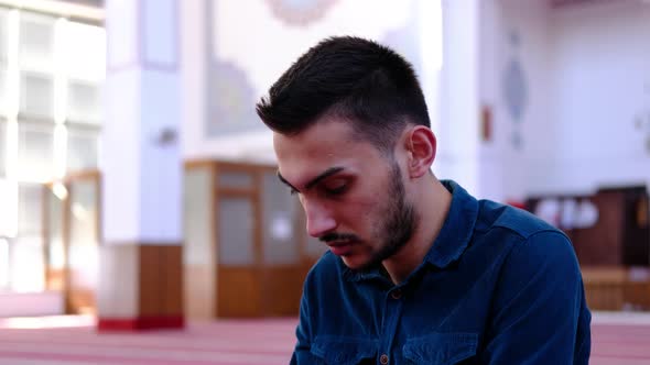 Youth Turning His Head in the Mosque