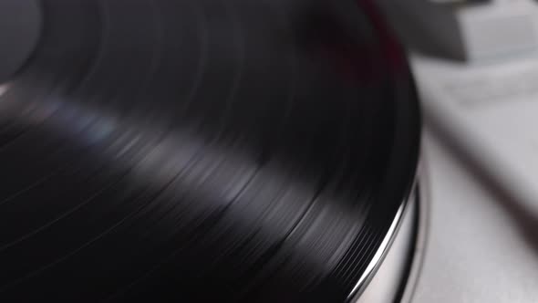 Vinyl Record Is Spinning On A Turntable With Arm And Needle