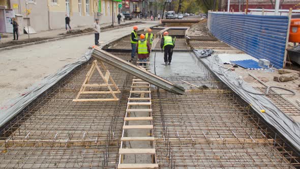 Concrete Works for Road Maintenance Construction with Many Workers and Mixer Timelapse