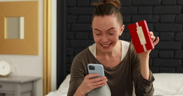 Woman Showing Gift By Video Call