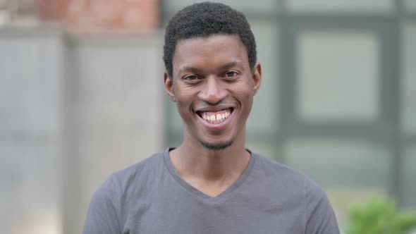 Portrait of Young Young African Man Saying Yes By Shaking Head