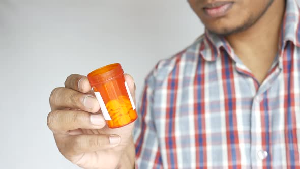 Person Hand Holding Pill Container