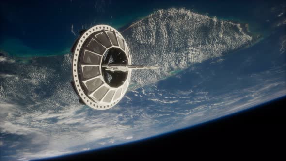 Futuristic Space Satellite Orbiting the Earth alt