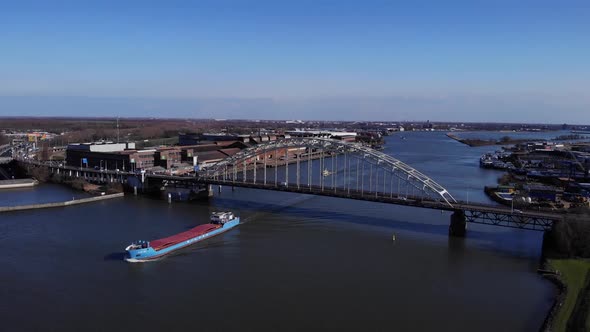 Marine Vessel Sailing Under The Bridge In River Noord Near Hendrik-Ido-Ambacht, South Holland, Nethe