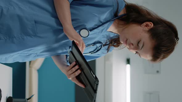 Vertical Video Woman Working As Nurse and Holding Digital Tablet